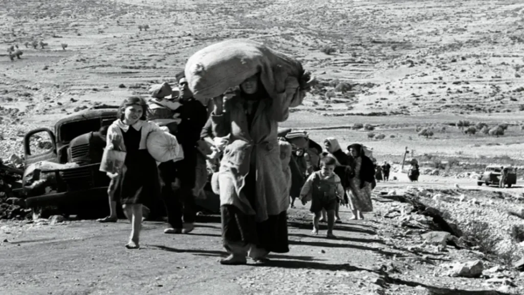 Palestinians carry their possessions on their heads as they flee from a village in Galilee about five months after the creation of the state of Israel in 1948 [File: Reuters]